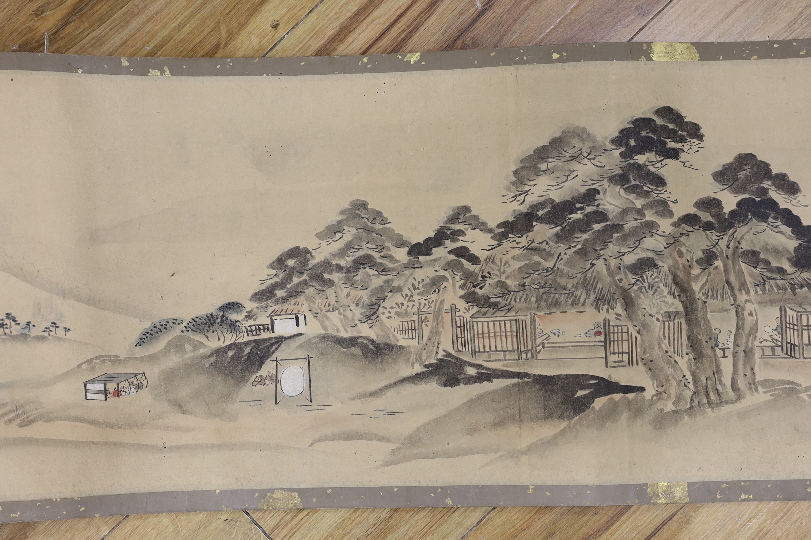 A Japanese landscape painting on paper hand scroll, Edo period, titled views, now in two parts, incomplete, image 27cm high x approximately 470cm wide